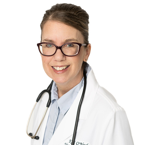 A headshot of Kari O'Neal, FNP-C. She is wearing a white coat over a blue shirt and has a stethoscope around her neck.