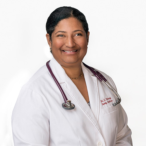 A headshot of Dr. Lisa Ramsay, D.O. She is wearing a white coat with a stethoscope around her neck.